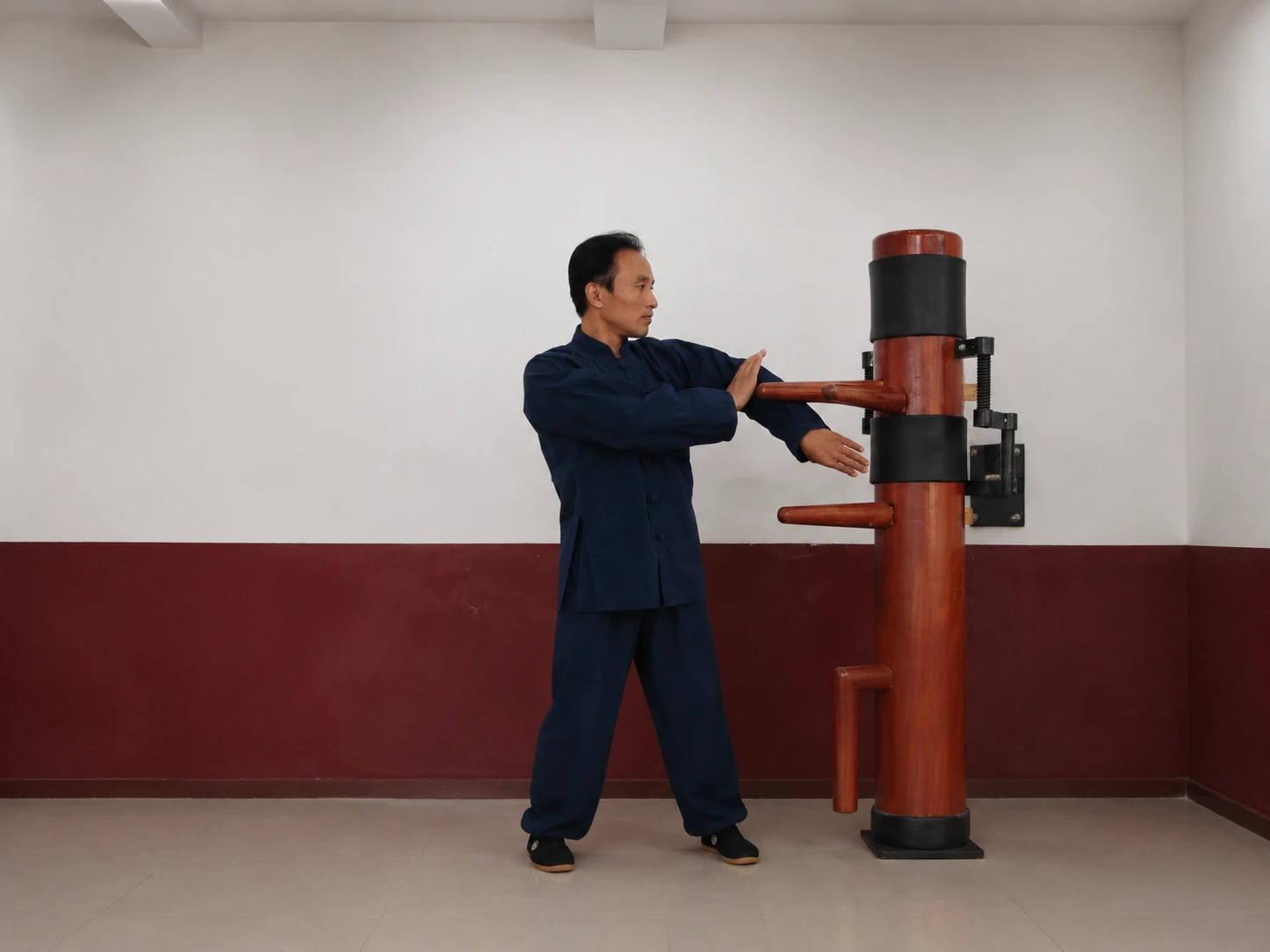 Photo of Principal Guo Xinmin Training on Wooden Dummy